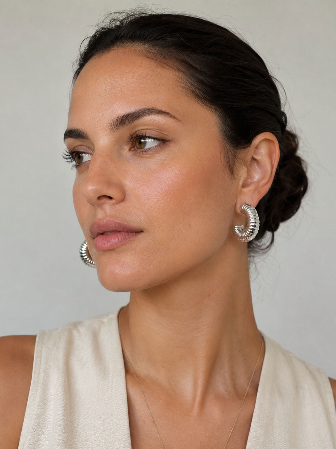 Silver grooved dome hoop earrings with ribbed texture and polished silver-plated finish