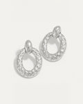 Silver hammered oval stud earrings with textured surface and high-polish finish – lightweight and sculptural.