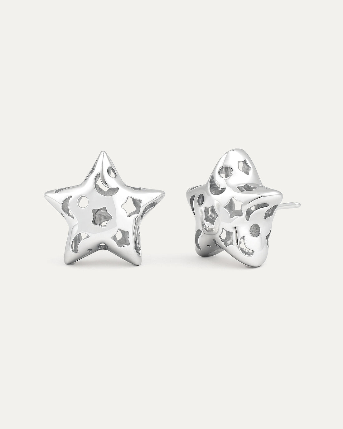 silver-plated hollow star stud earrings with cutout details and polished modern minimalist design