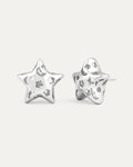 silver-plated hollow star stud earrings with cutout details and polished modern minimalist design