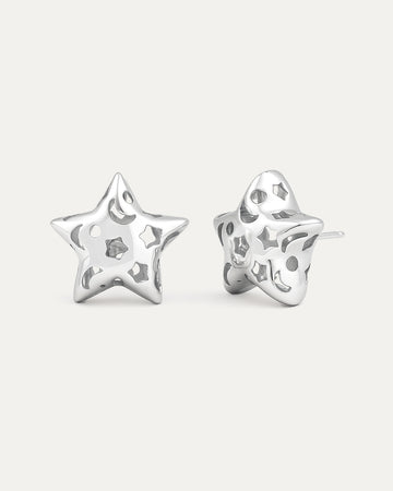 silver-plated hollow star stud earrings with cutout details and polished modern minimalist design