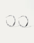 Pair of silver hoop earrings on a white background