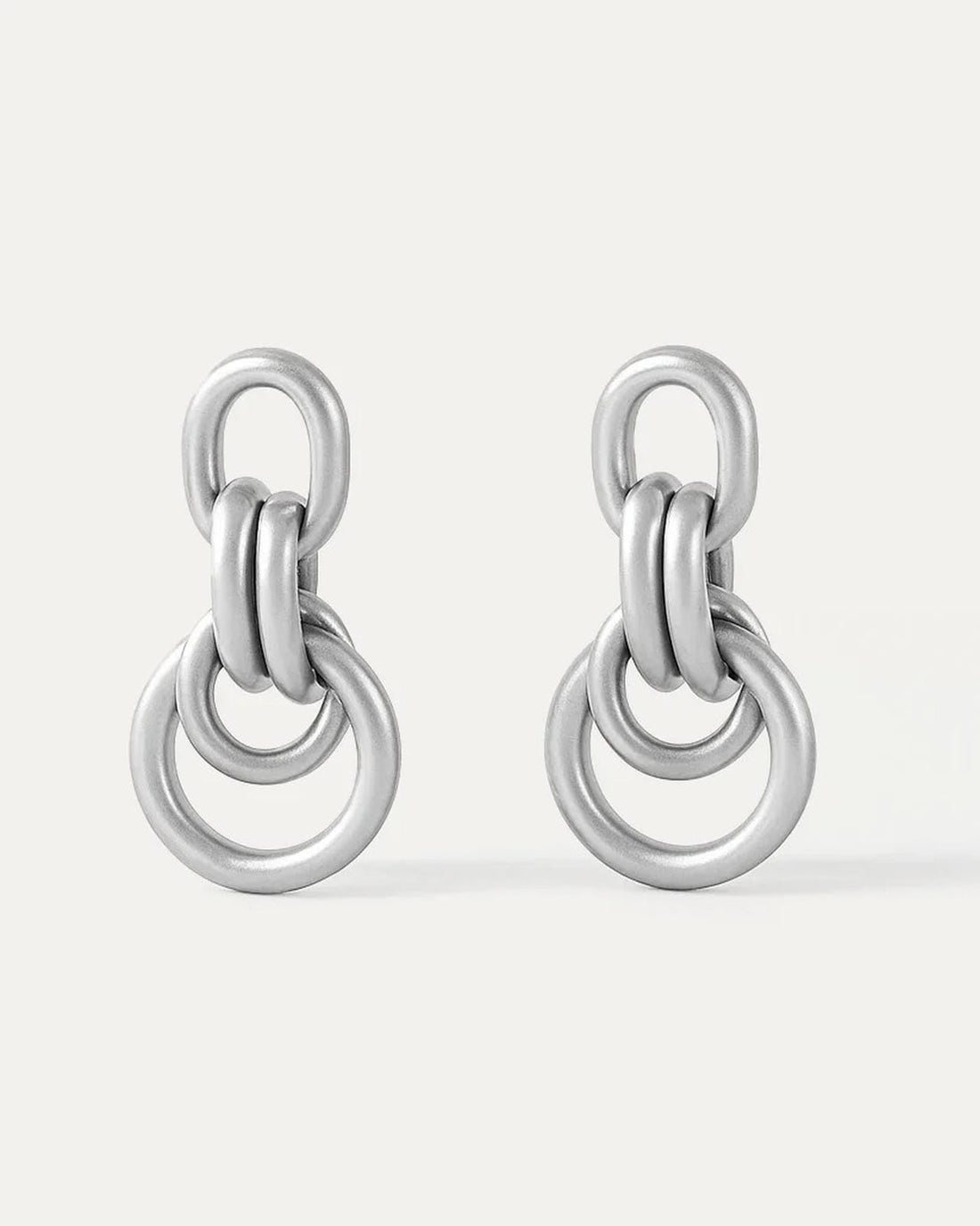 Pair of silver chain-link earrings on a white background