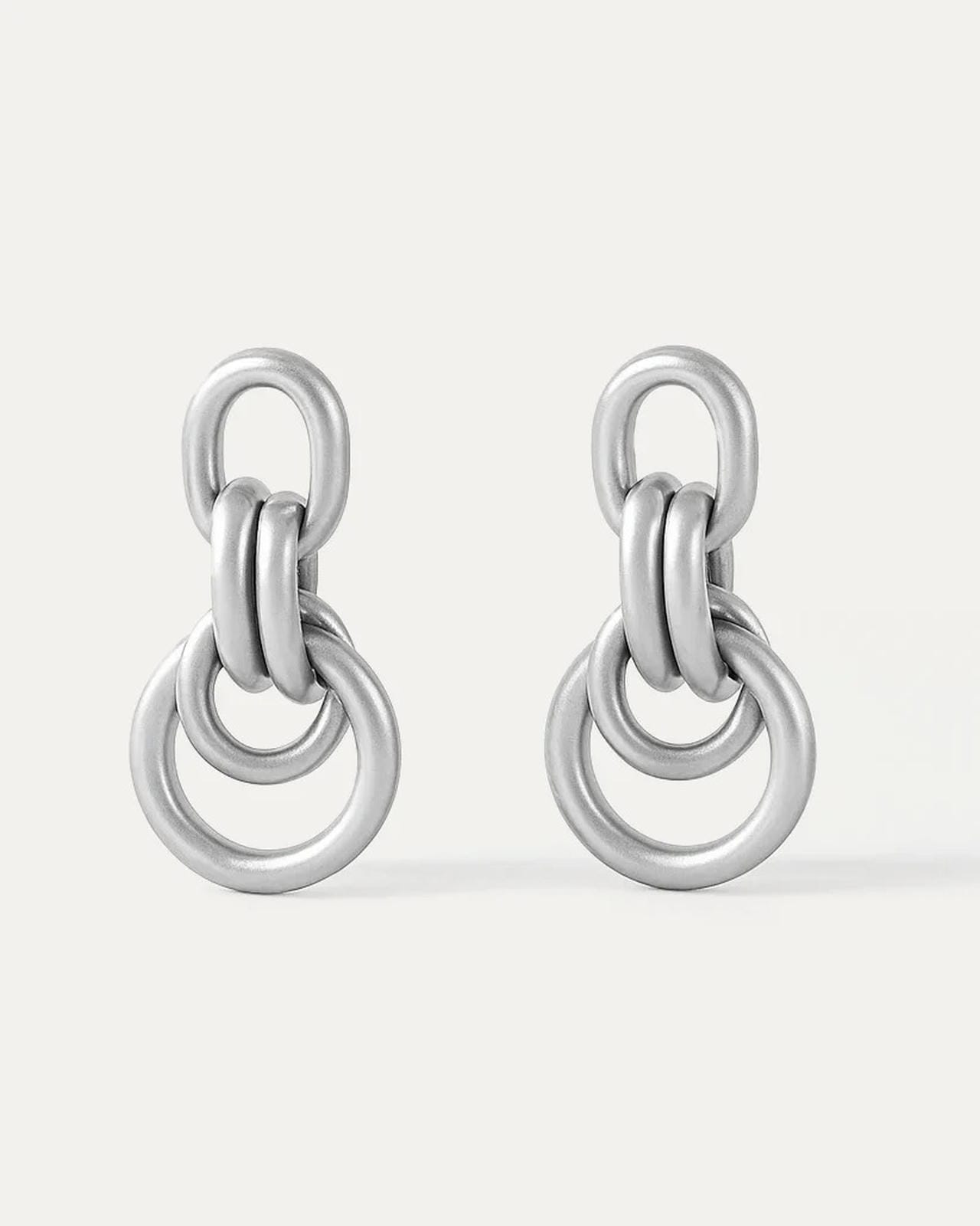 Pair of silver chain-link earrings on a white background