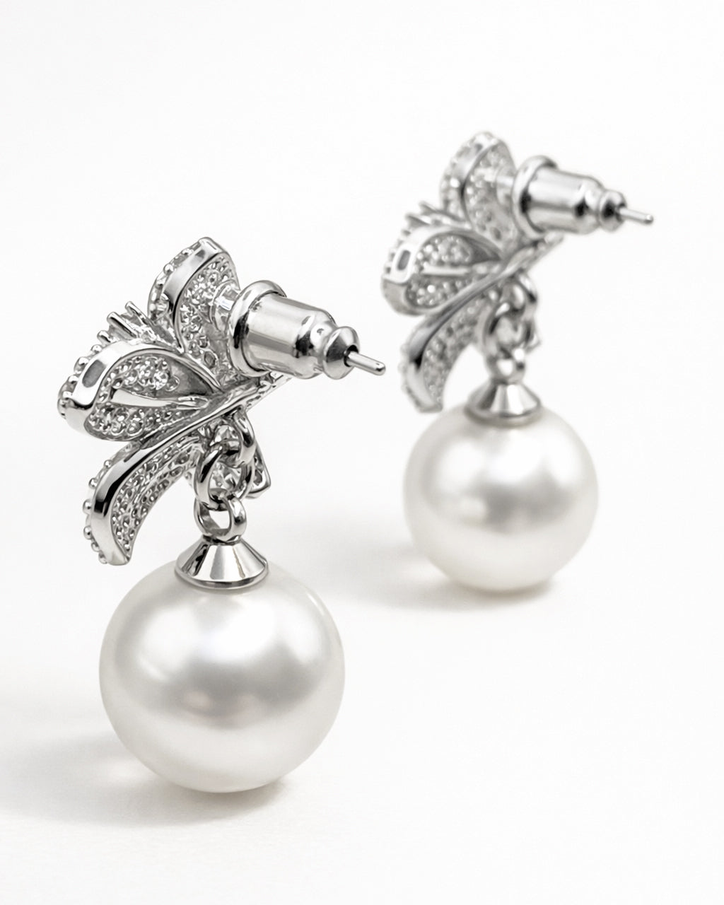 Pearl drop earrings back view with cubic zirconia floral detail silver tone