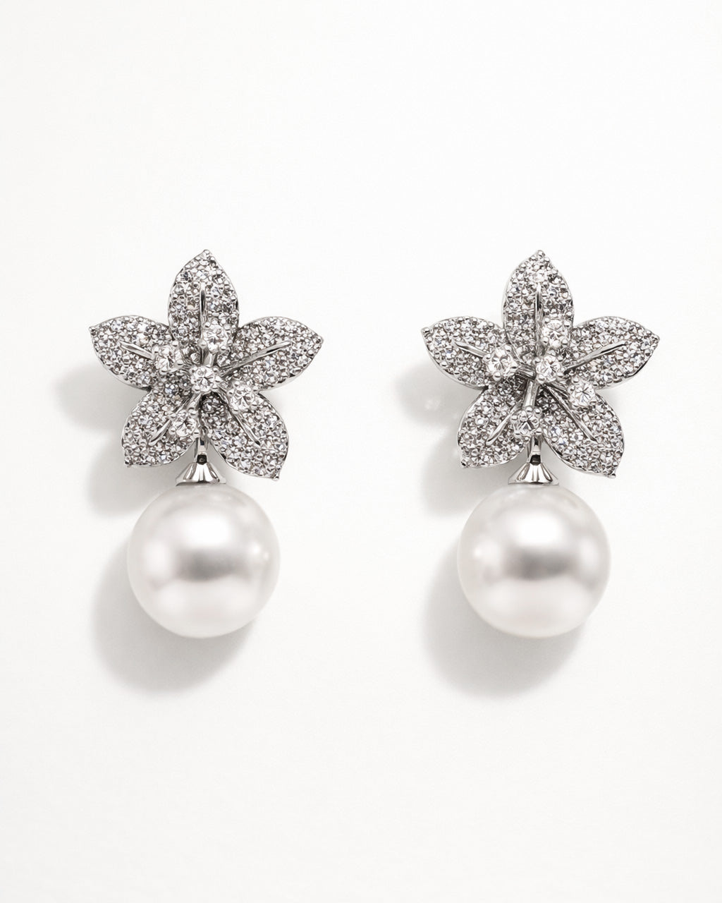 Ivory Bloom pearl drop earrings with cubic zirconia floral design front view