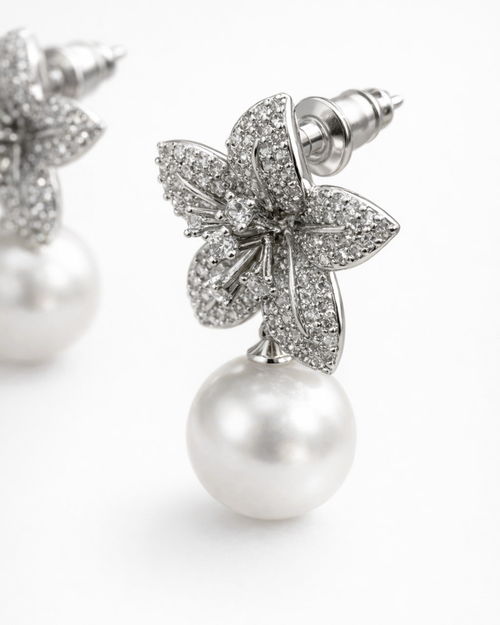 Ivory Bloom pearl drop earrings with cubic zirconia floral design side view