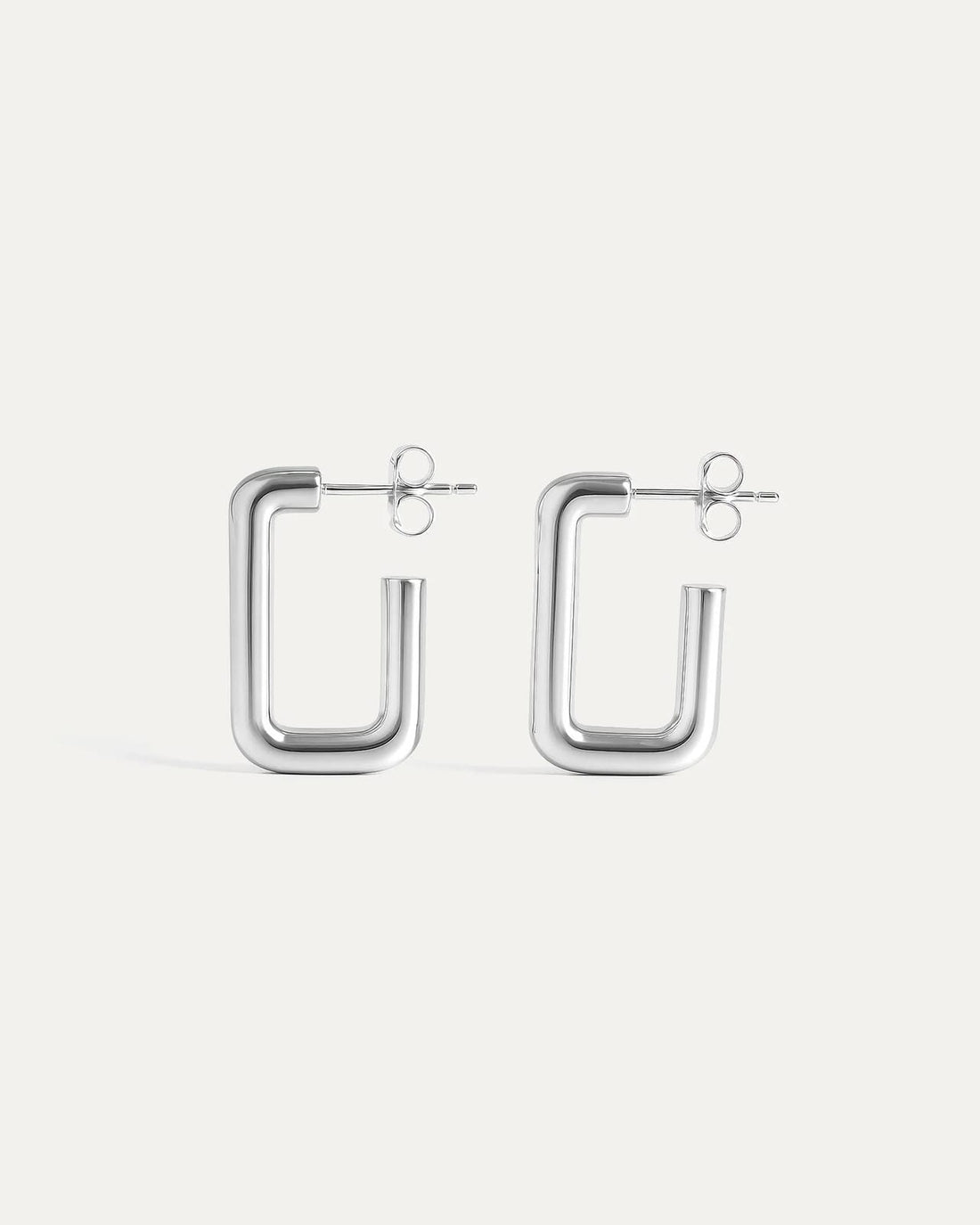 Silver hoop earrings on a white background
