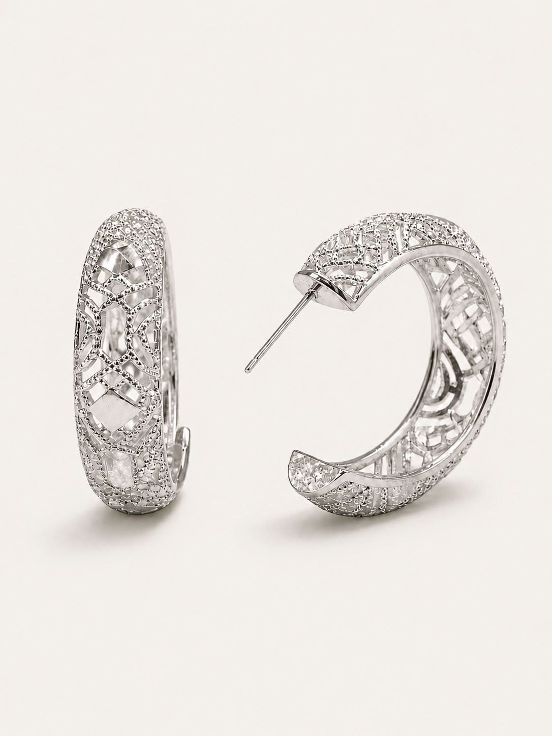 Silver lattice hoop earrings with openwork geometric pattern and polished silver finish