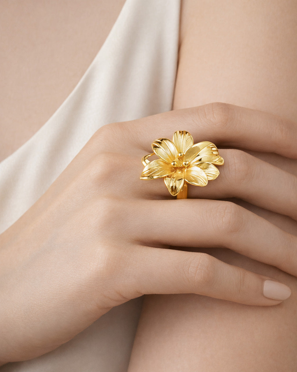 18K gold-plated lily burst flower ring on model hand, elegant statement jewelry