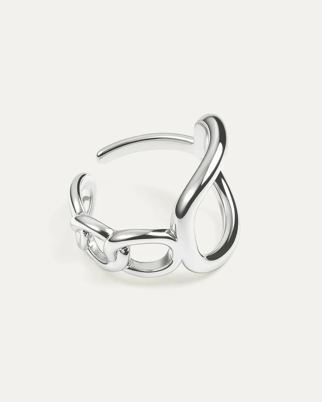 Silver open ring on a light gray background