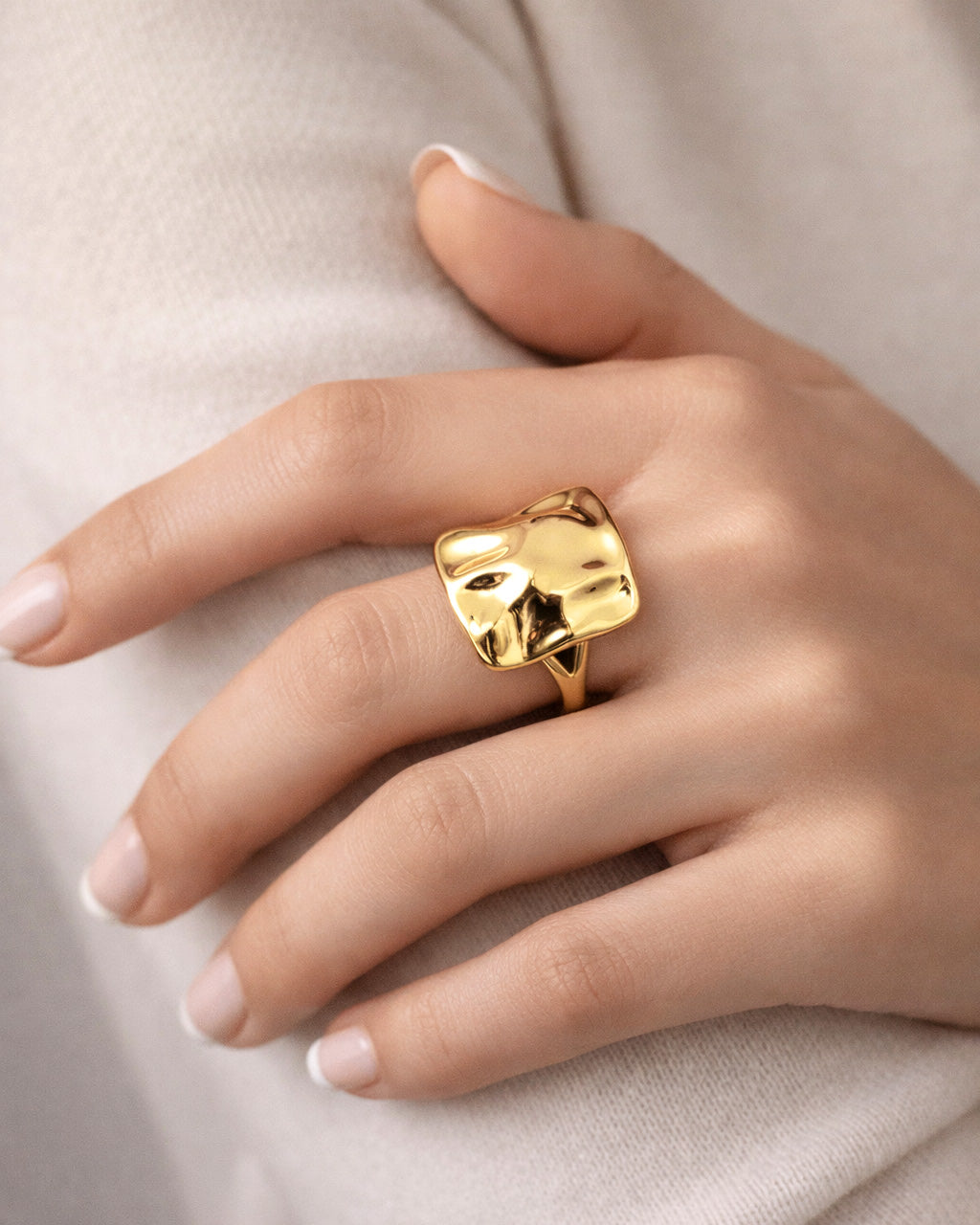 Bold gold statement ring with molten square sculptural face