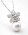 Pearl drop flower pendant necklace with zircon stones, gold plated 45 degree angle view