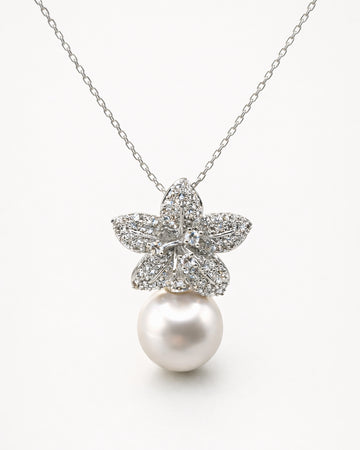 Pearl drop flower pendant necklace with zircon stones, gold plated elegant front view