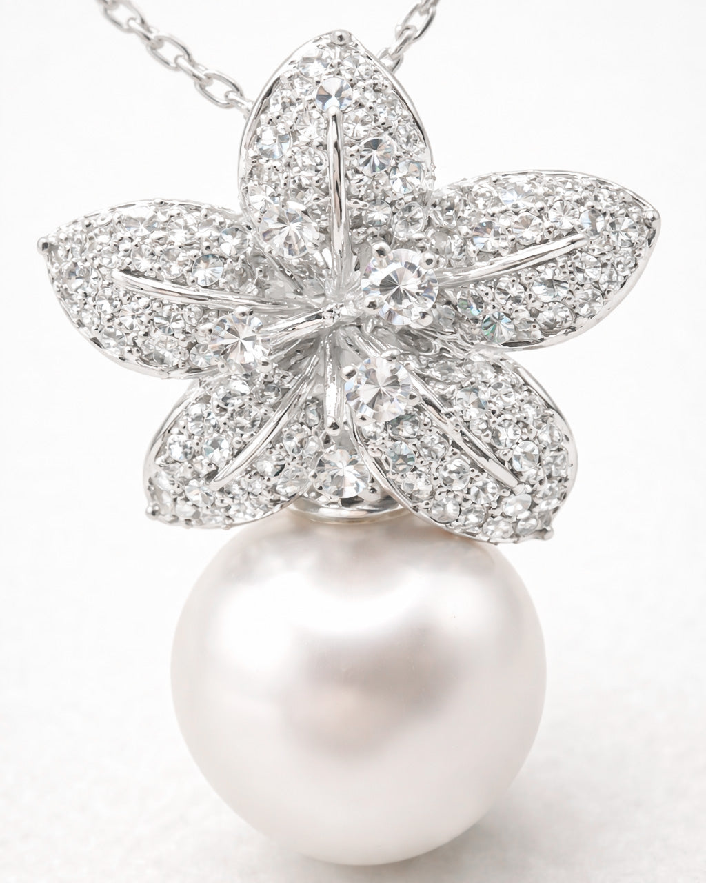 Pearl drop flower pendant necklace with micro pave zircon stones, macro flower detail