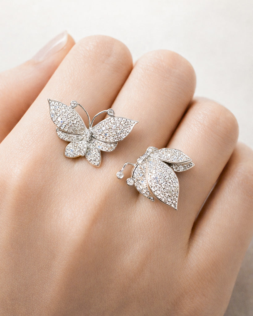 Butterfly adjustable silver ring with micro pavé CZ stones, worn on hand detail