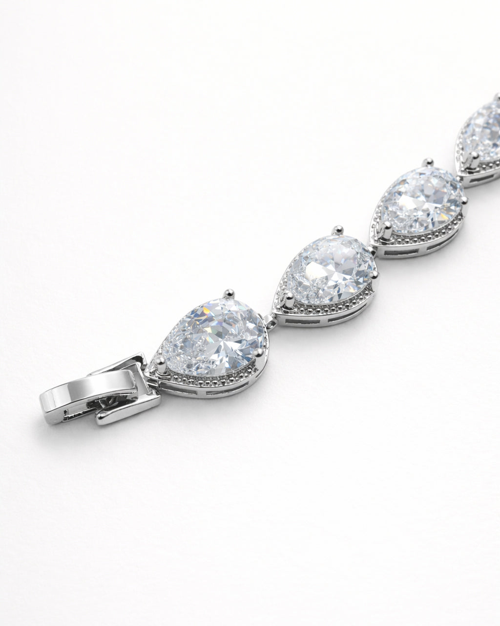 Lumière drop tennis bracelet close-up with clear zircon stones, silver plated