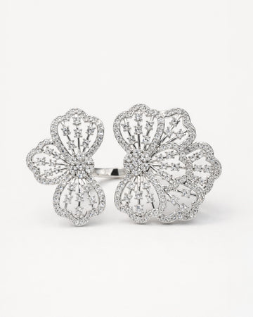 Floral adjustable silver ring with zircon stones, elegant openwork flower front view