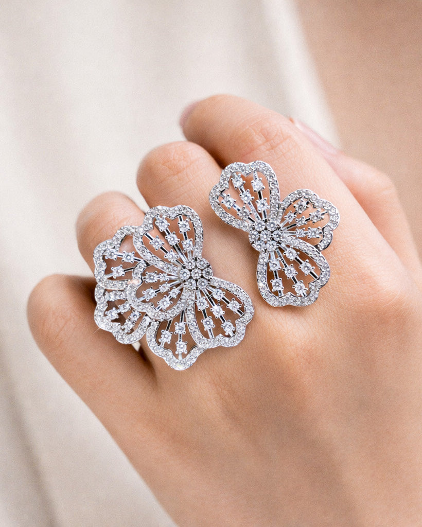 Floral adjustable silver ring with zircon stones, worn on hand elegant view detail