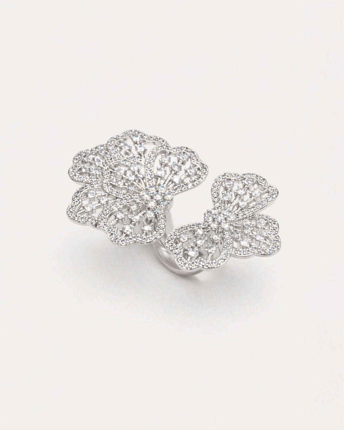 Floral adjustable silver ring with zircon stones, elegant openwork flower top view