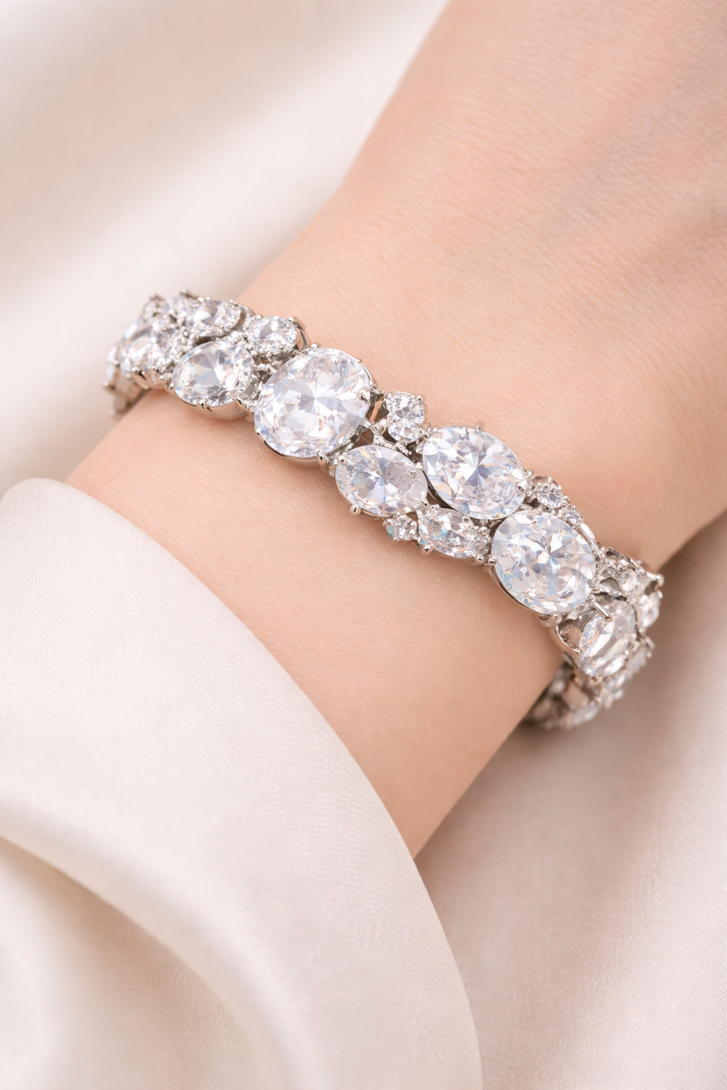 Oval CZ tennis bracelet in silver plated finish with stones, front view detail