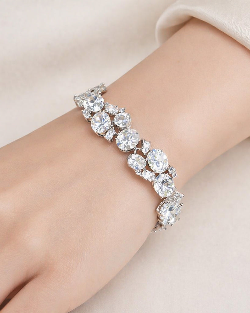 Oval CZ tennis bracelet in silver plated finish, model wearing on wrist view detail