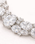 Jadejuri silver tennis bracelet with oval cubic zirconia stones, macro close-up