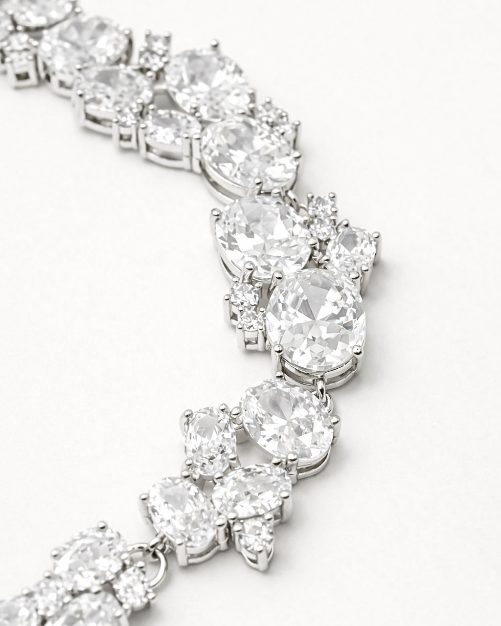 Oval CZ tennis bracelet in silver plated finish with brilliant zircon stones close-up