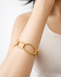 18K gold-plated link bracelet on model wrist, minimalist statement jewelry