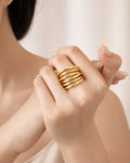18K gold-plated luxe layer ring on model hand, bold minimalist statement jewelry