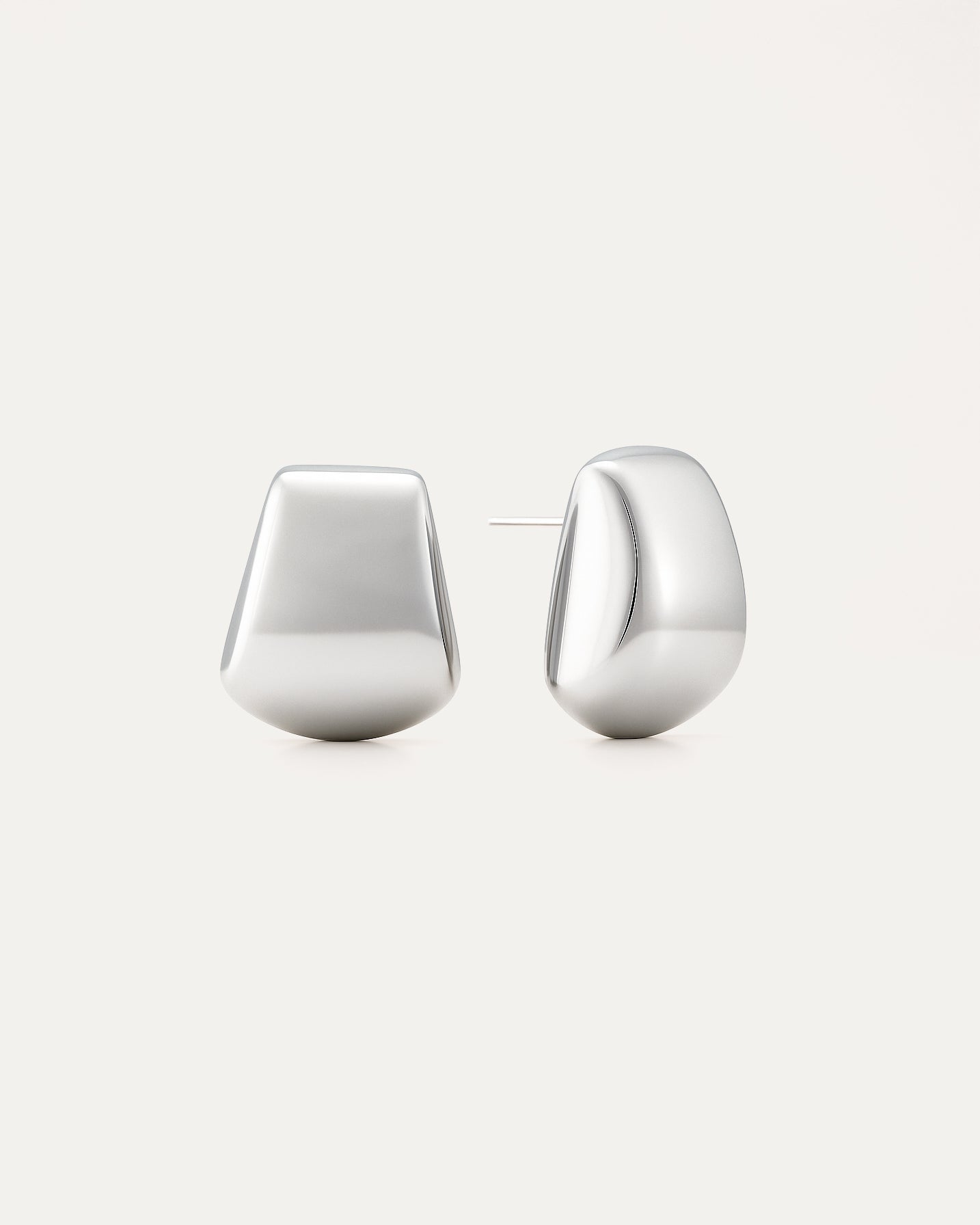 Pair of silver hoop earrings on a white background