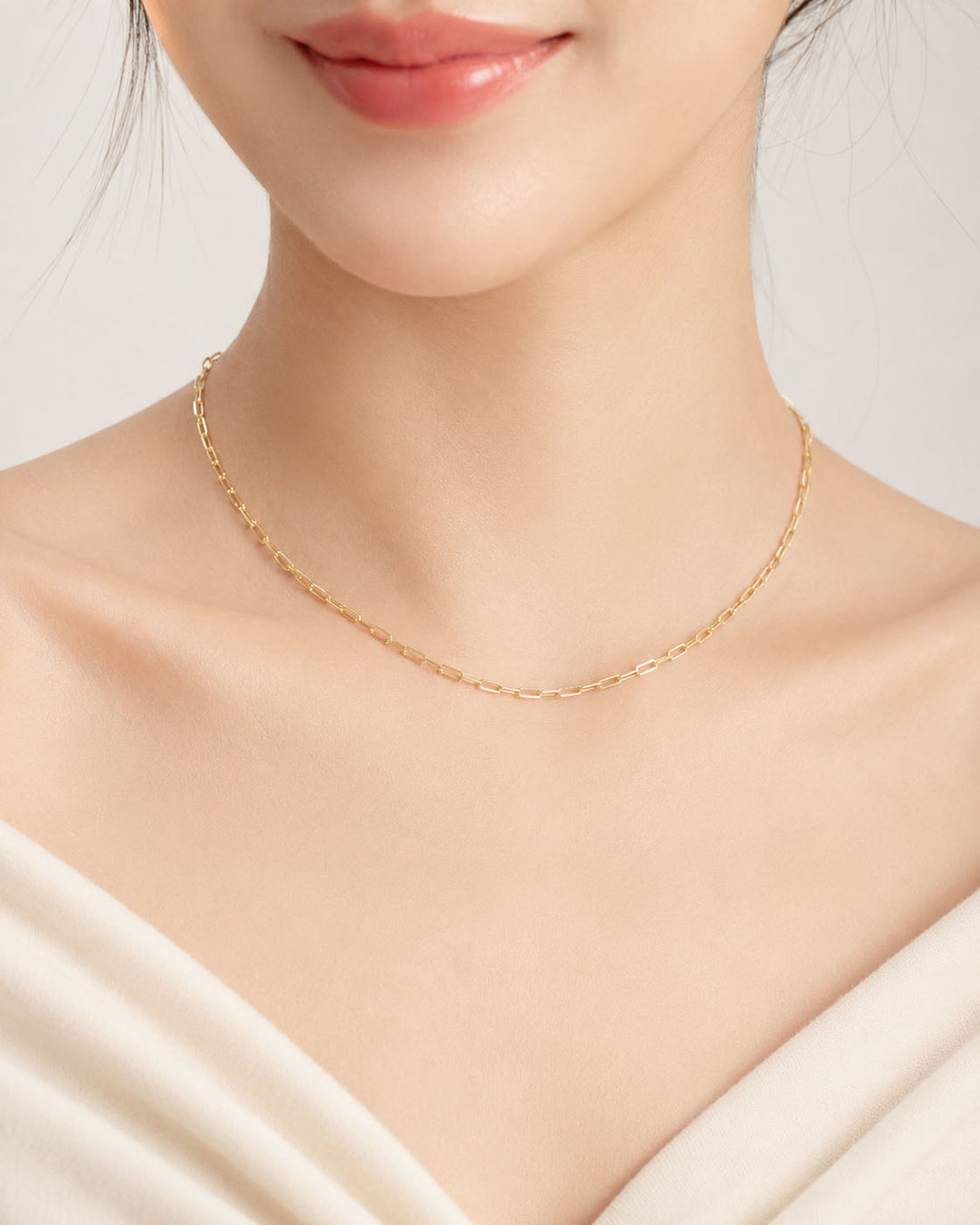Gold chain necklace on a white background