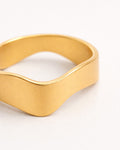 18k gold plated minimalist wave ring close-up, modern women's jewelry design
