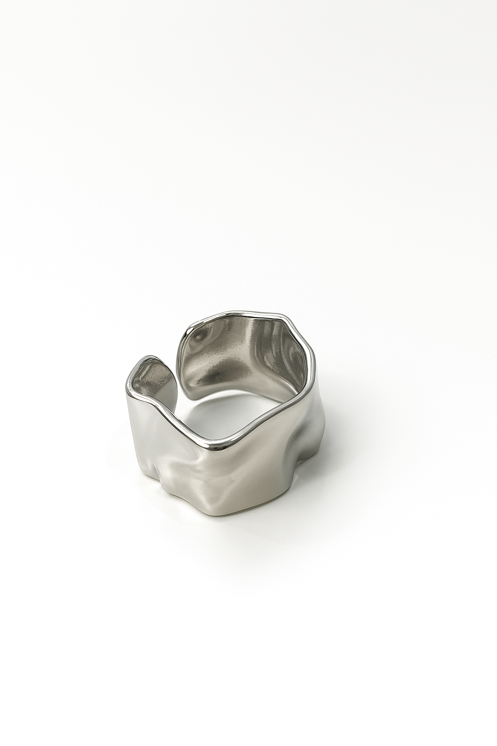 silver-plated ring with molten wave design and open back on white background