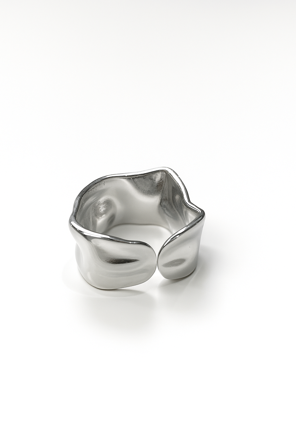 silver-plated ring with molten wave design and open back on white background