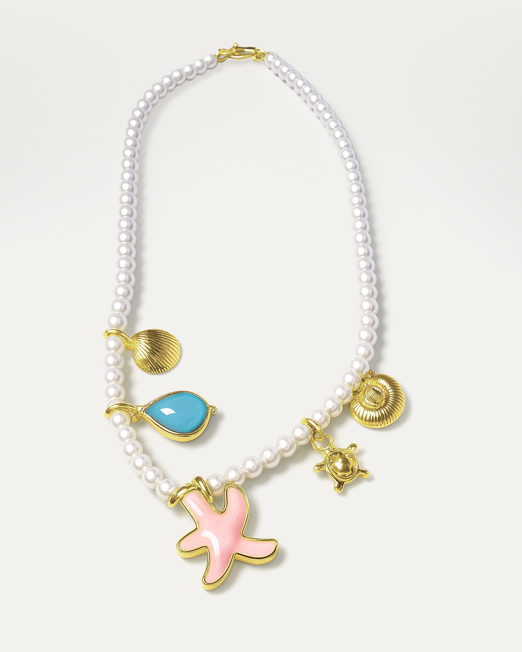 Oceana Pearl necklace with pearl beads and sea-themed charms like starfish, turtle, and seashell – ocean-inspired jewelry.