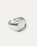 A chunky, open-cuff silver signet ring with a high-polish finish. The ring features a thick, adjustable band and a large, rou
