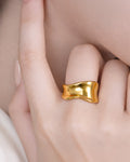 18K gold-plated organic wave ring on model hand, minimalist statement jewelry