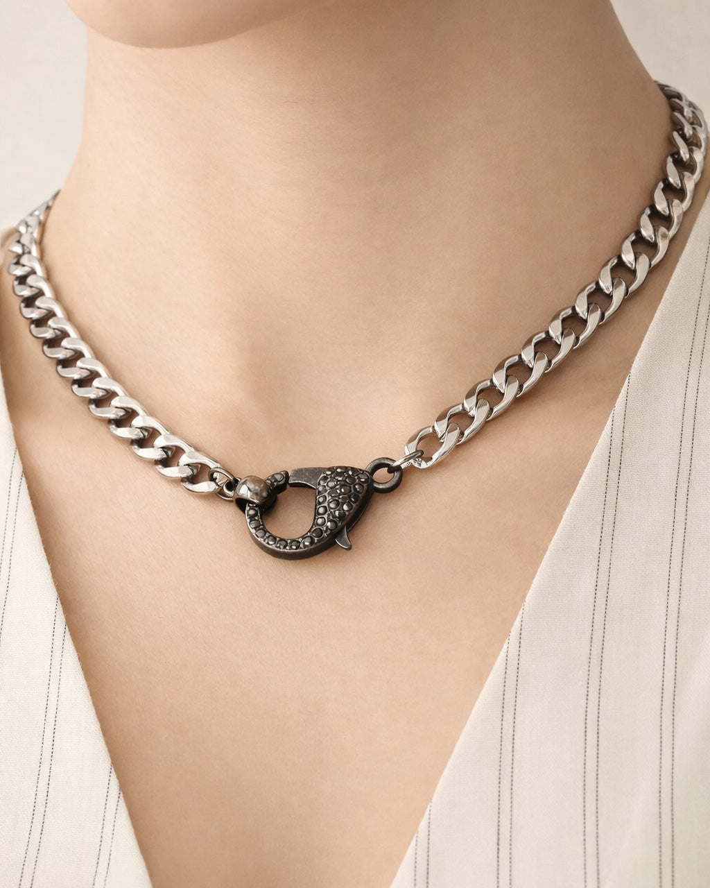 Silver-plated panther claw choker necklace styled on model, edgy statement look