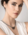 Silver-plated panther claw choker necklace styled on model, edgy statement look