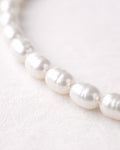Freshwater pearl necklace close-up with natural luster, elegant women’s jewelry design