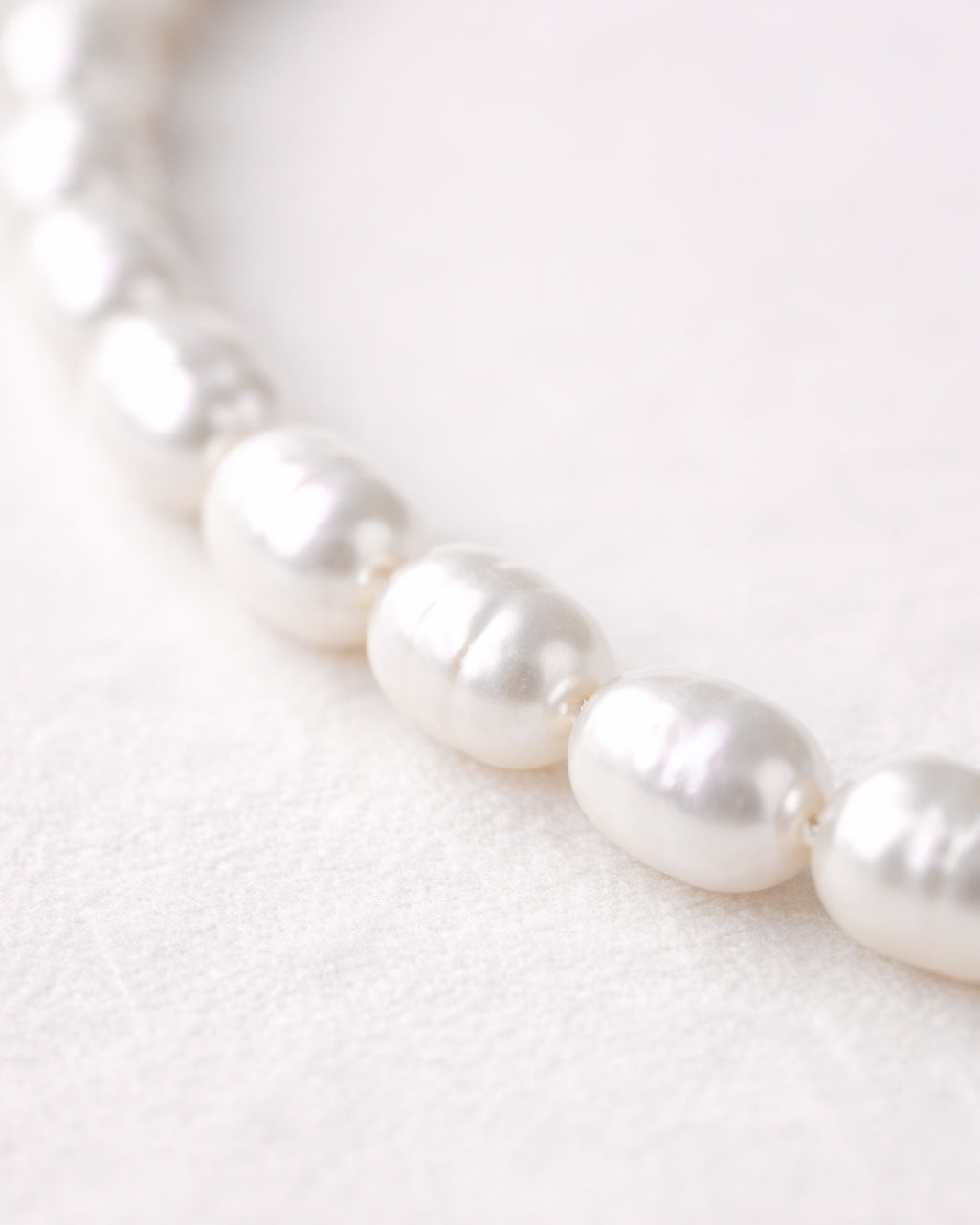 Freshwater pearl necklace close-up with natural luster, elegant women’s jewelry design
