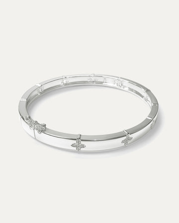 Silver bracelet with floral designs on a white background