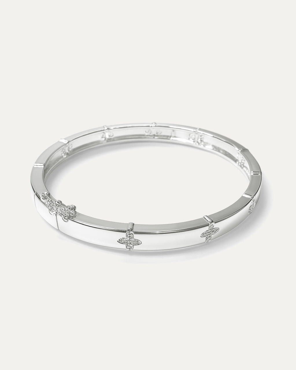 Silver bracelet with floral designs on a white background