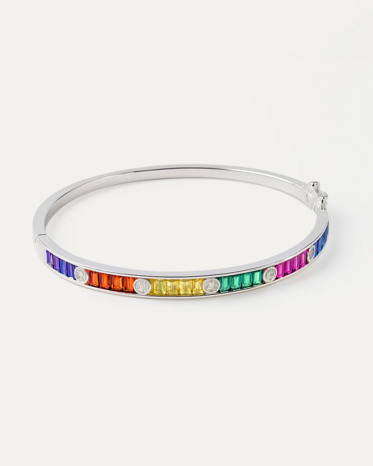 Silver bangle with rainbow-colored stones on a white background