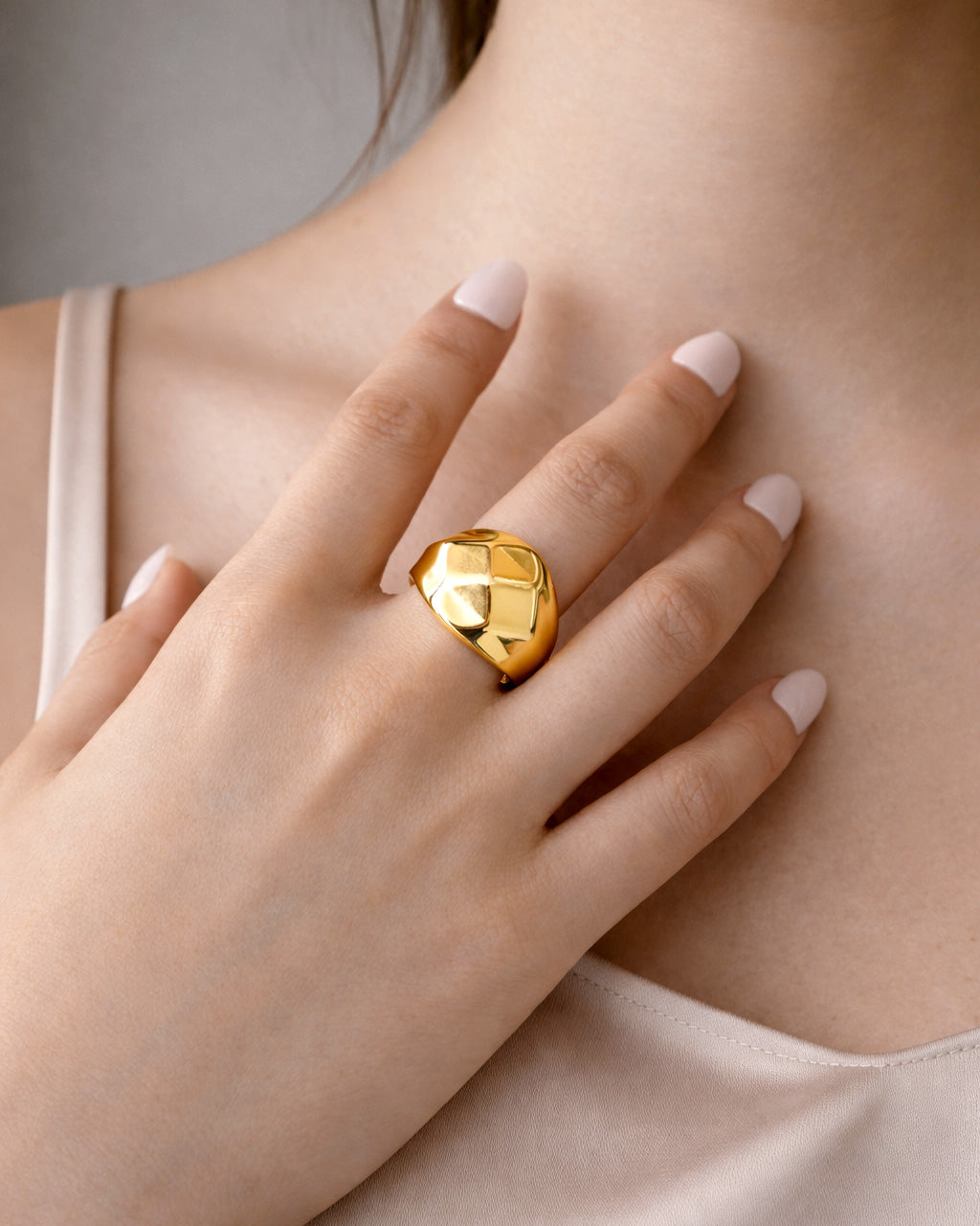 18K gold-plated pyramid signet ring on model hand, modern minimalist jewelry