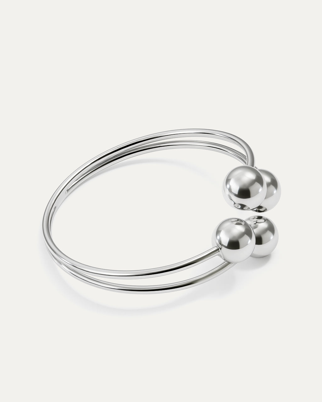 Minimal silver cuff with four polished spheres – Quad Sphere Bracelet.