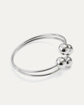 Minimal silver cuff with four polished spheres – Quad Sphere Bracelet.