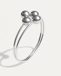 Minimal silver cuff with four polished spheres – Quad Sphere Bracelet.