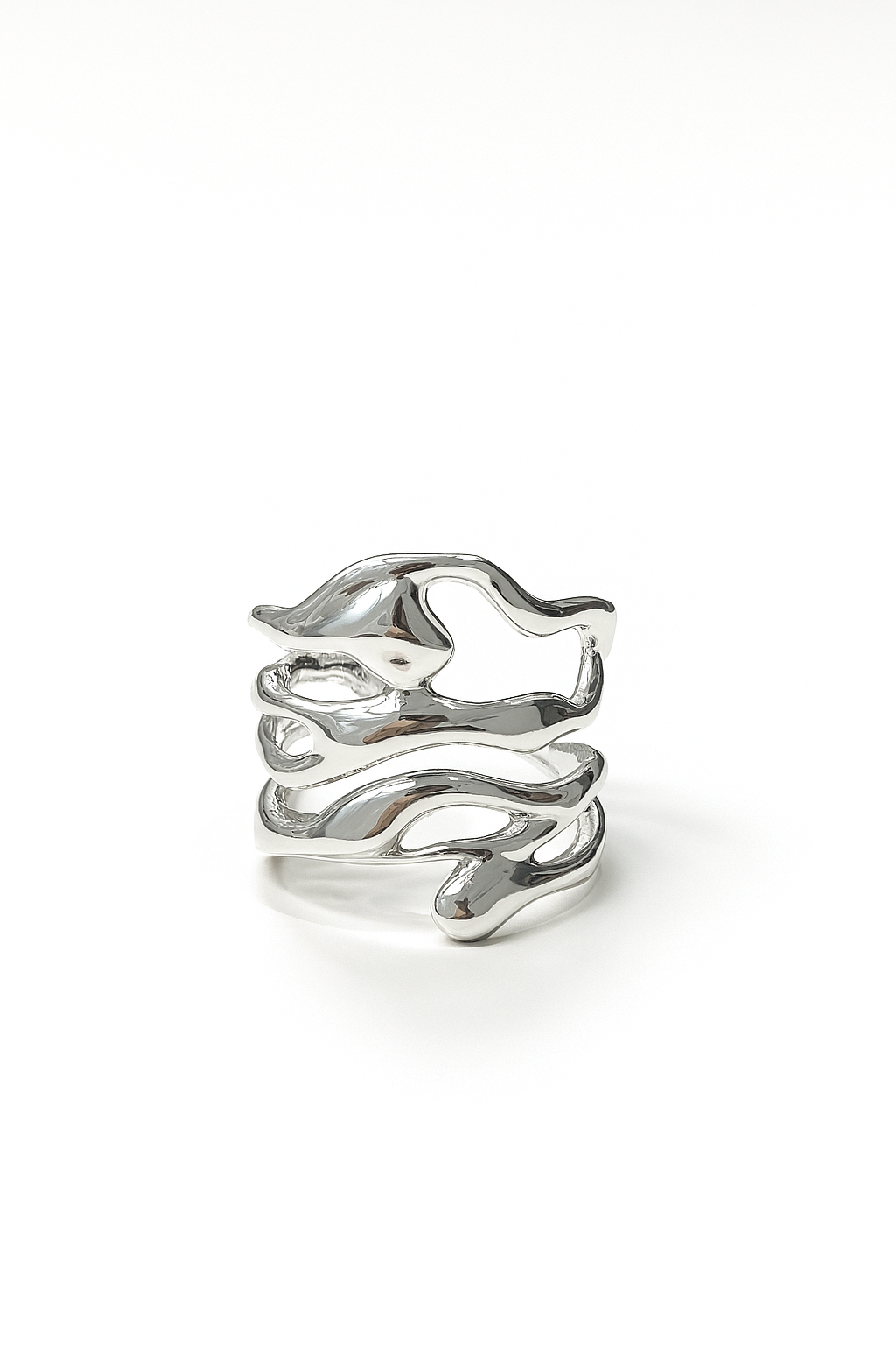 organic open silver ring with sculptural branch-like design on white studio background